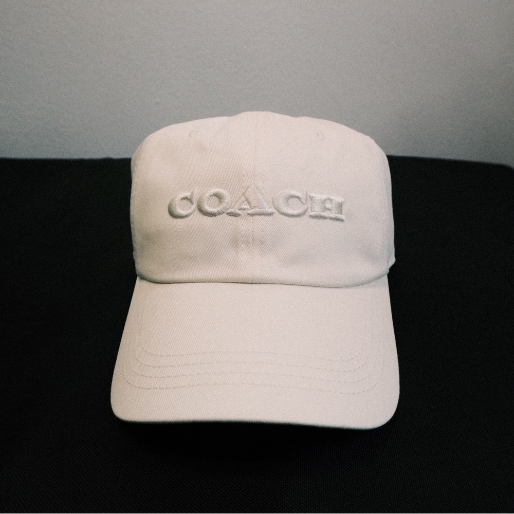Coach white, red or brown embroidered baseball hat. (Sold separate)